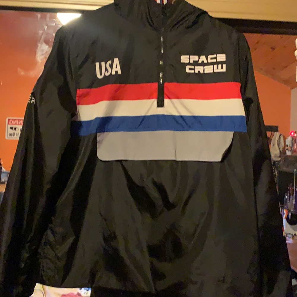 A Nasa windbreaker. reflective pouch